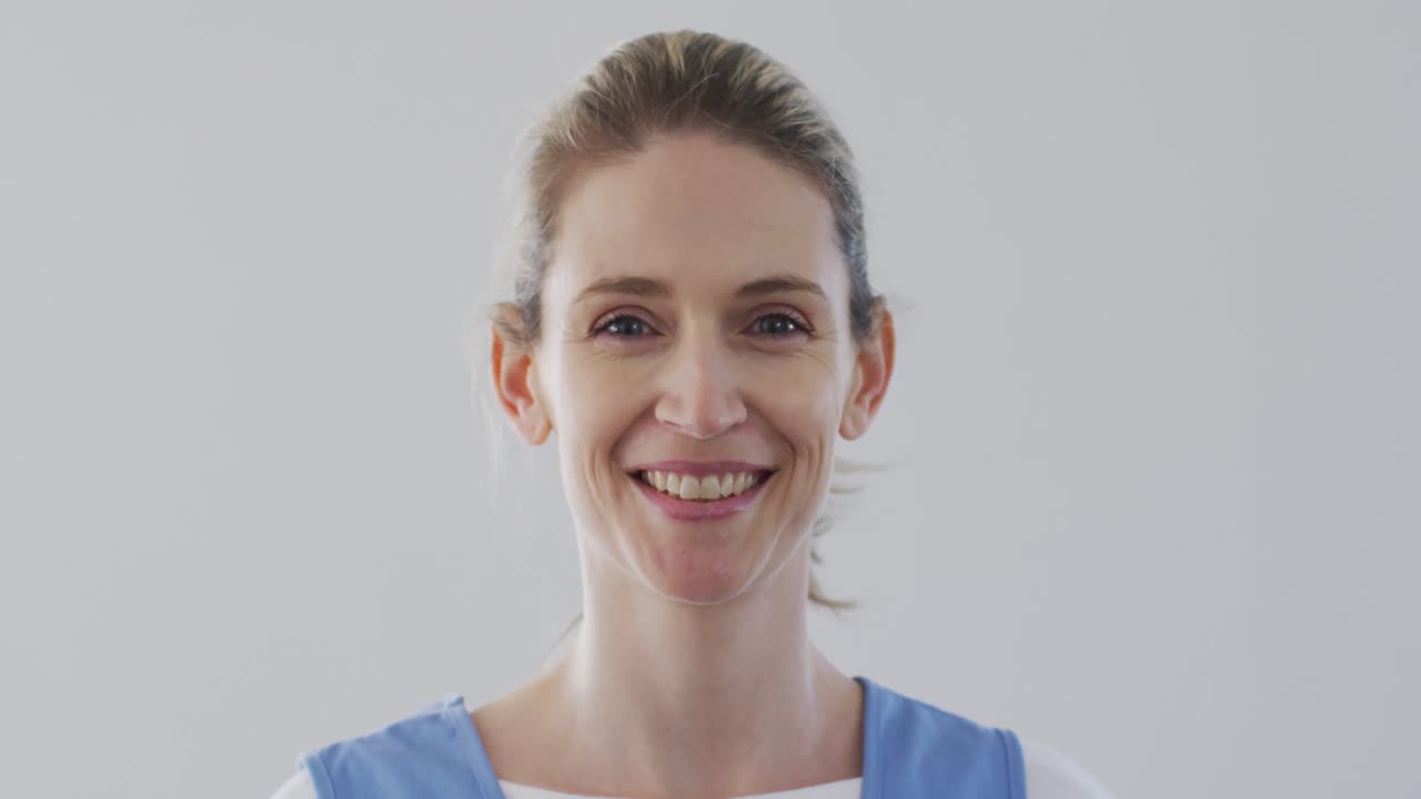 Female health worker smiling at home