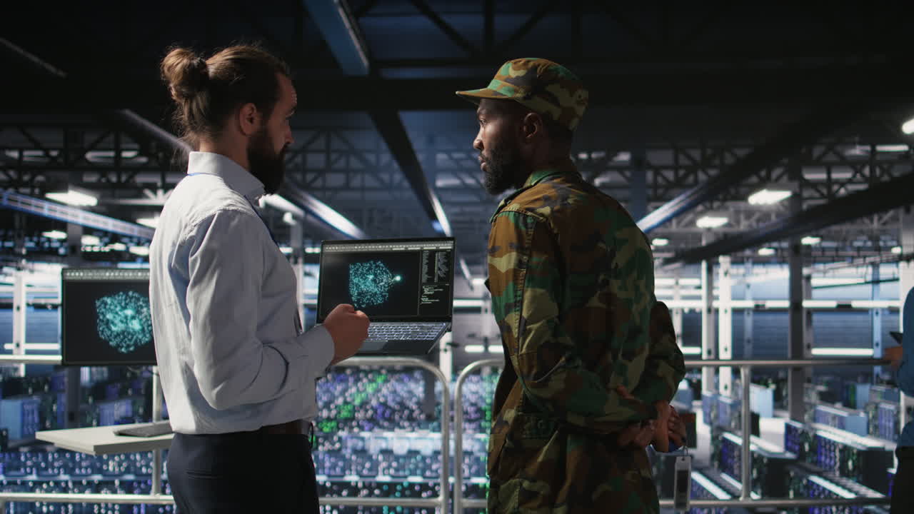 Military server room IT professionals using AI LLM tech on laptop