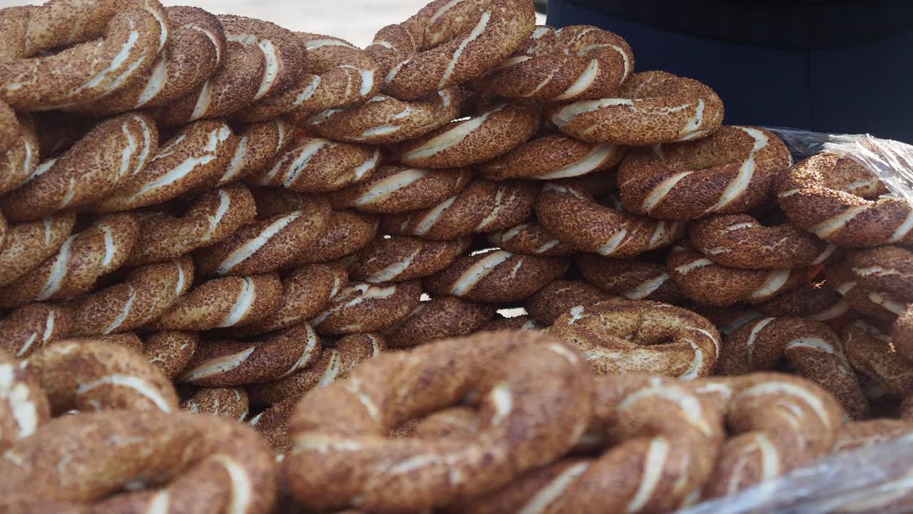Hand Arranging Freshly Baked Turkish Simit Bread Rings