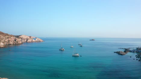 yachts in mandrakia bay milos island greece