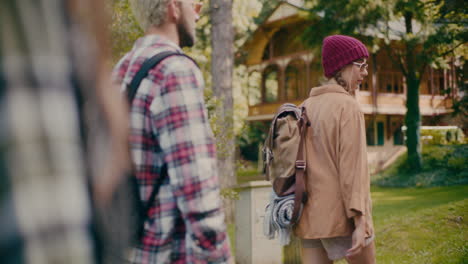 woman wearing knit hat hiking with friends