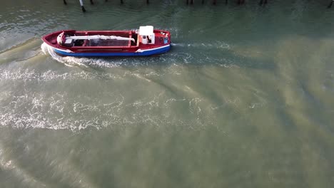 view of a boat passing through a canal in venice, italy