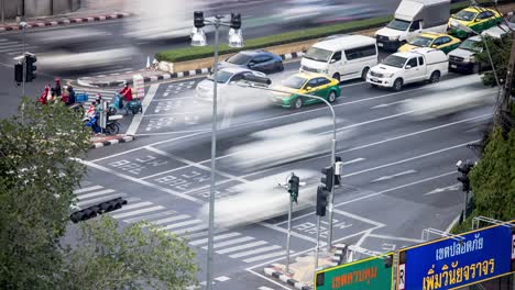 large volume of vehicles at the intersection in bangkok city, thailand