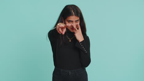 Indian-woman-pointing-at-her-eyes-and-camera-show-I-am-watching-you-gesture-spying-watching-someone