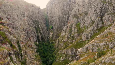 This-drone-shot-captures-a-picturesque-landscape-featuring-a-mountain-with-intersecting-hills