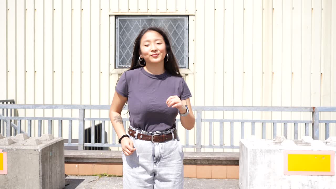 Woman in front of building