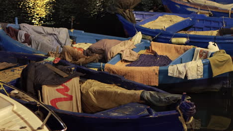 close up of small fishing boats anchored at