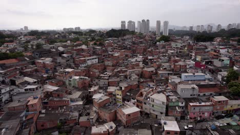 aerial view overlooking a slum neighborhood, in sao paulo, brazil - circling, drone shot