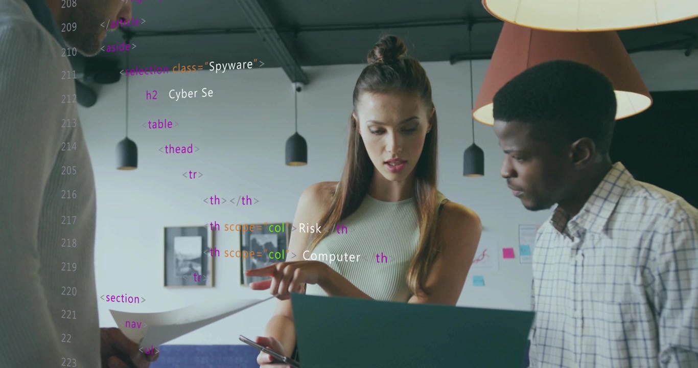 Team reviewing cybersecurity layout on laptop with printouts sparking HTML overlay refining design