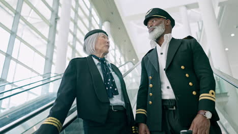 pilots, escalator and people at airport