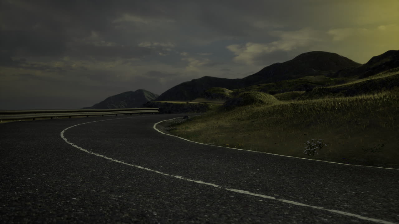 Curvy road in a remote landscape under an evening sky in tranquil setting