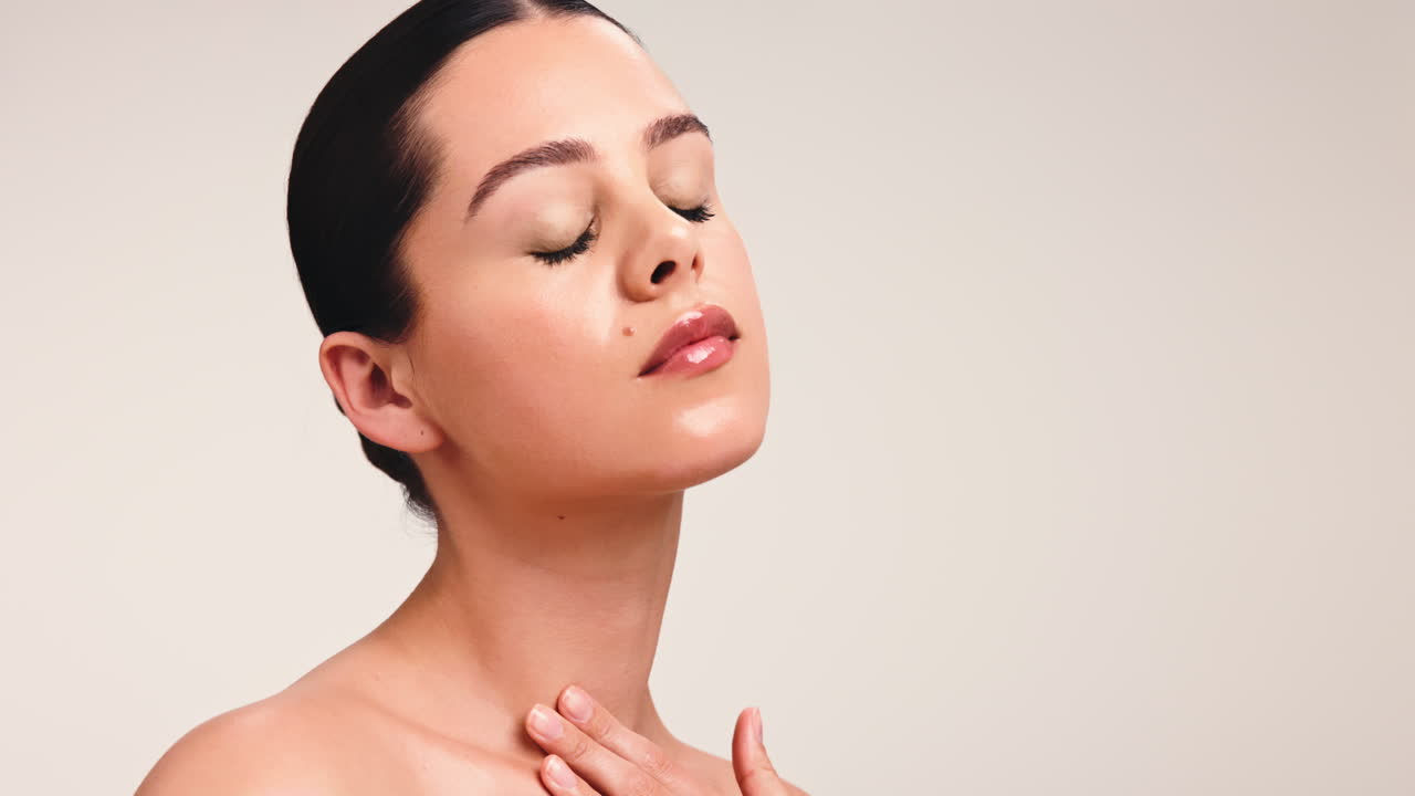 Beautiful woman with glowing skin and glossy lips