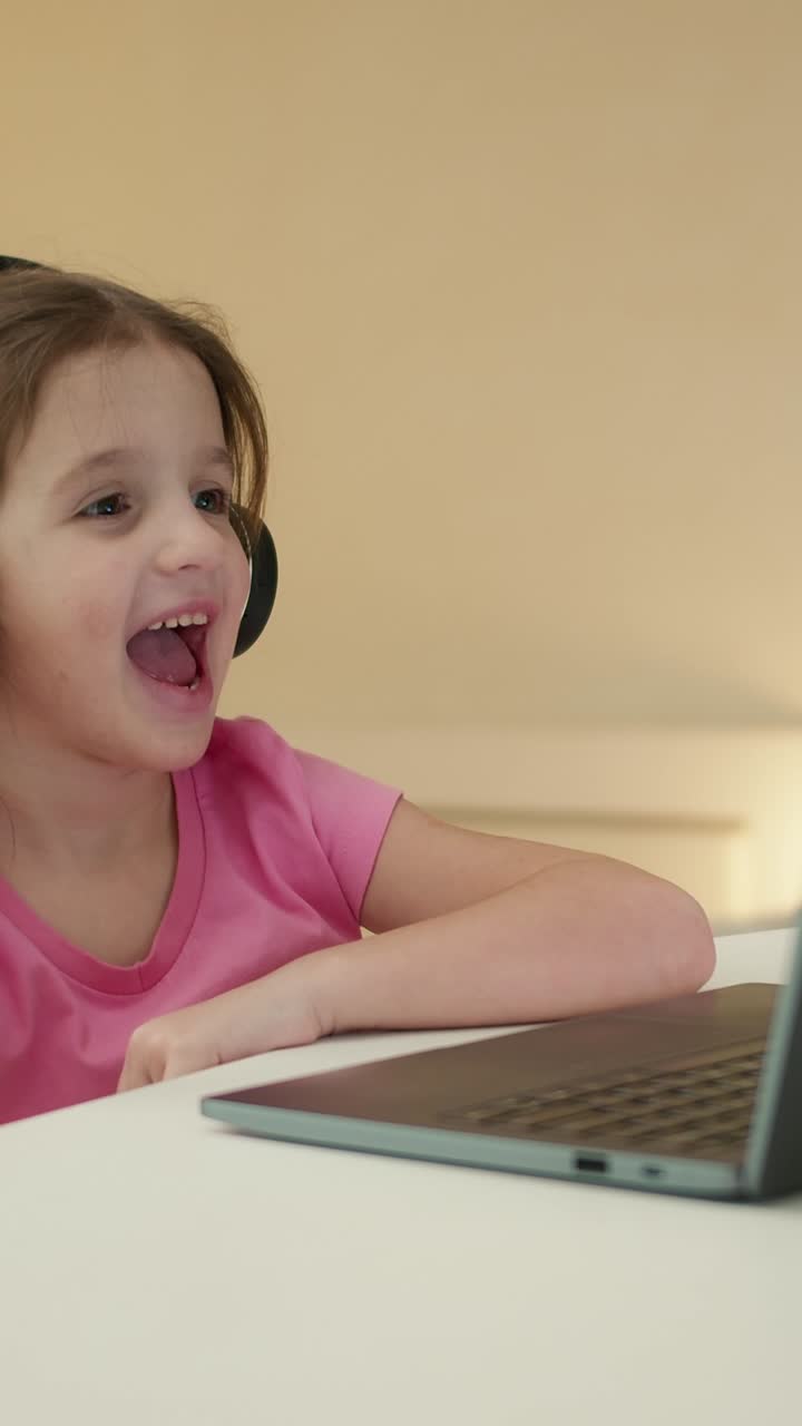 Girl watching a video call on laptop