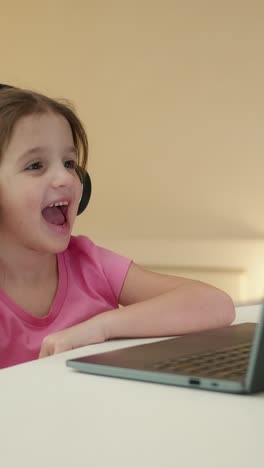 girl watching a video call on laptop