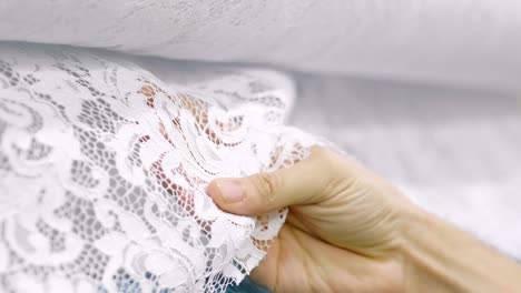 macro shot of a lace, fabric used to make elegant wedding dresses for the wedding day.