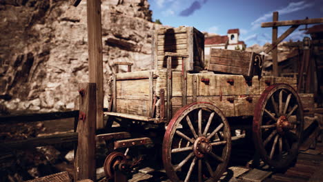 old wooden cart resting on a rustic dock in a deserted mining town