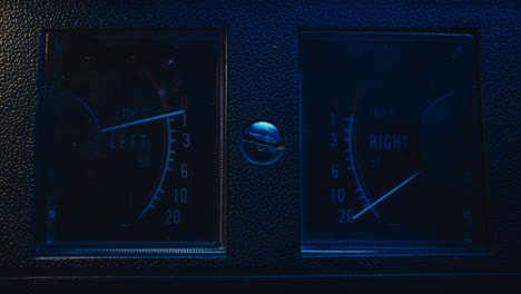 a close-up on a vintage tape recorder in a blue light