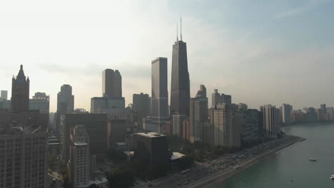 Wide-angle-aerial-view-of-downtown-Chicago-with-lots-of-cars-on-the-street-on-a-clear,-summer-afternoon