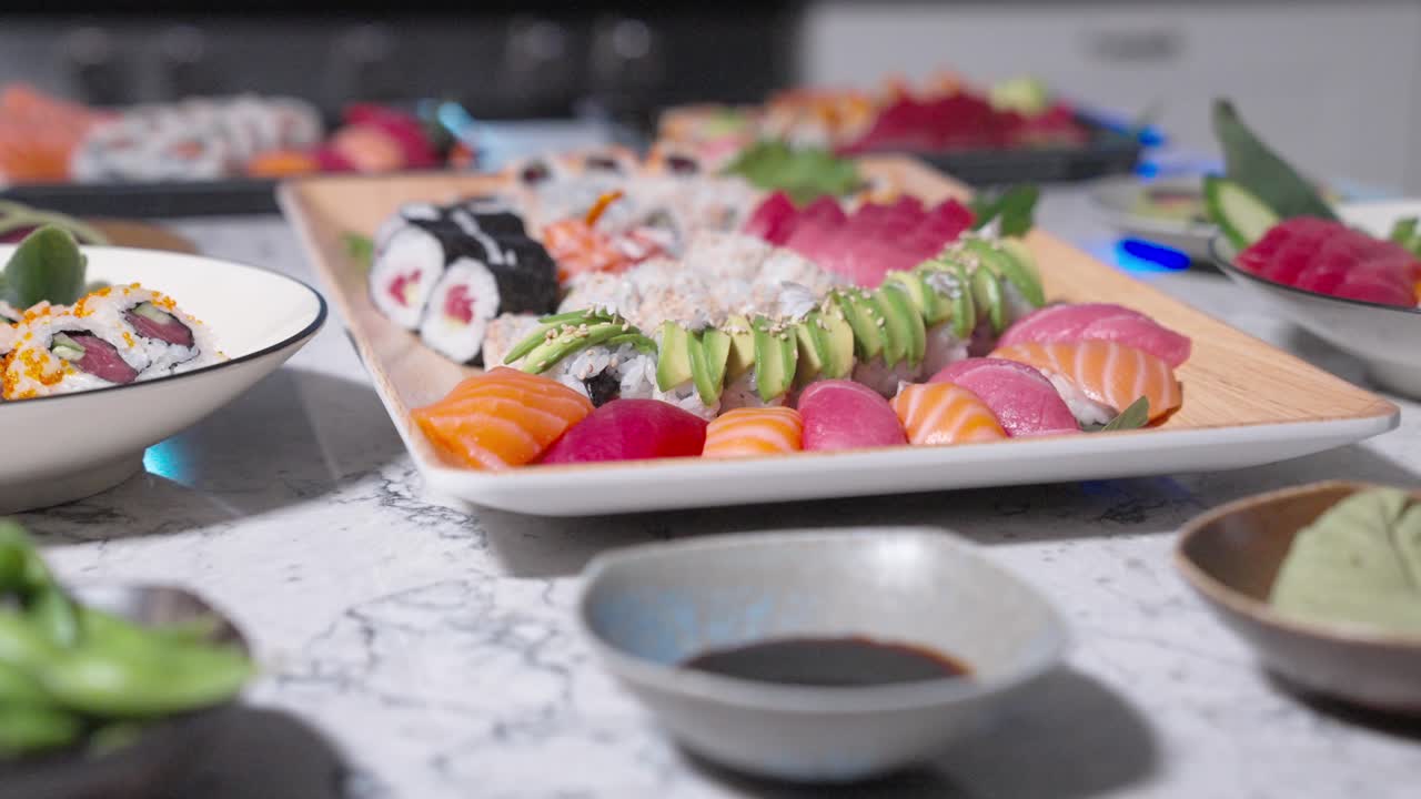 A sliding shot showcasing a variety of fresh sushi and sashimi rolls, highlighting the beauty of Japanese cuisine. Perfect for food presentations, sushi assortments, and restaurant menus.