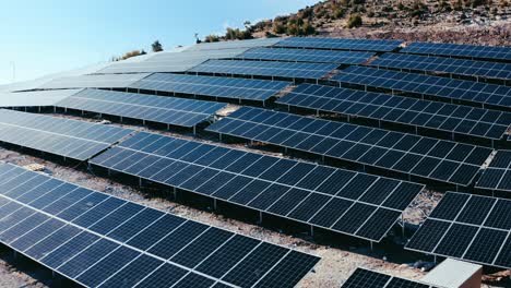 Drone-shot-of-solar-panel-rows-at-a-solar-power-facility