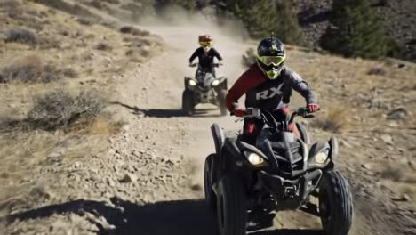 atv riders on mountain trail