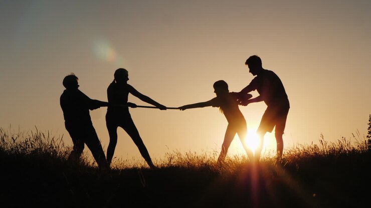 Children And Adults Compete In Tug Of War A Healthy And Active Lifestyle