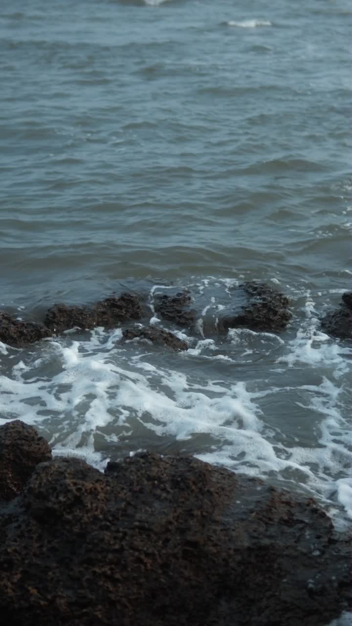 Waves Crashing on Rocks at the Ocean Coast