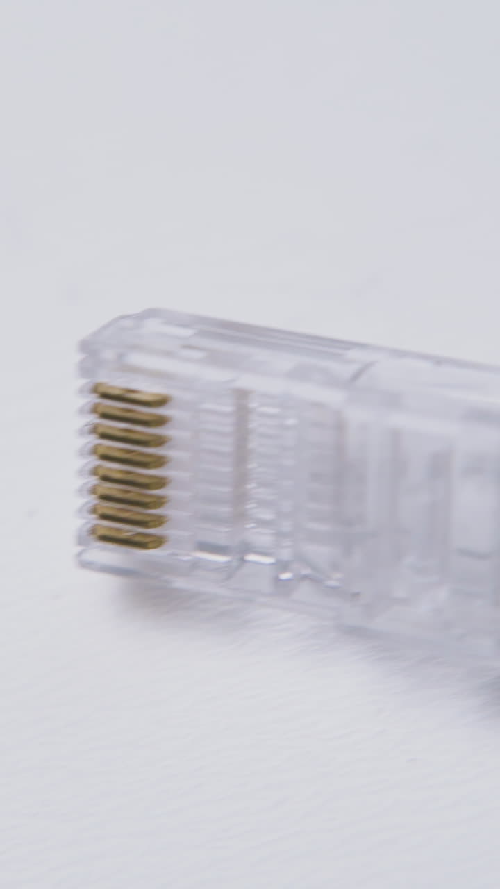 motion above modern plastic transparent connectors on clean light background extreme close view