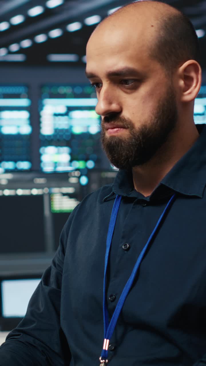 Bearded IT Engineer Working in Modern Data Center