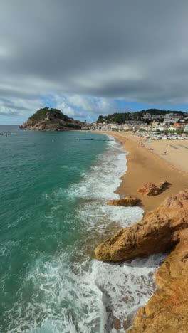 vertical video tossa de mar, a beautiful mediterranean town on spain’s costa brava. explore its stunning beaches, historic castle, and charming streets,