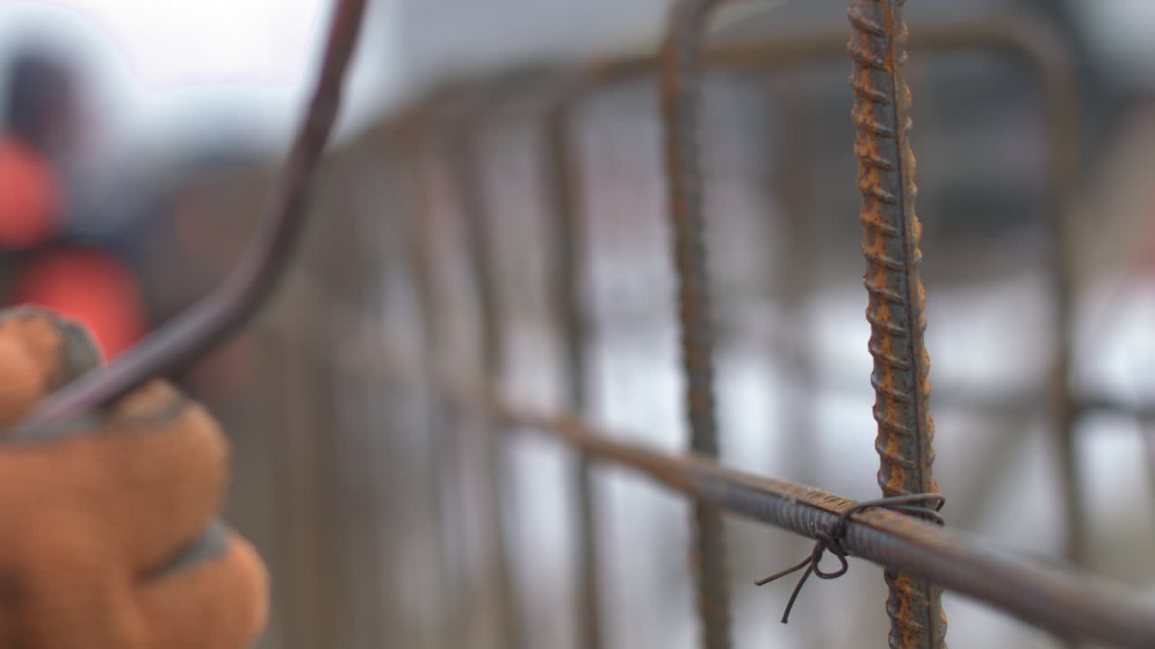 Construction Worker Handling Rebar