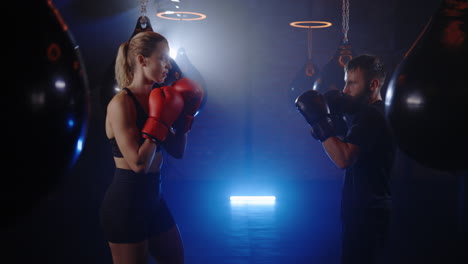woman and man boxing training session