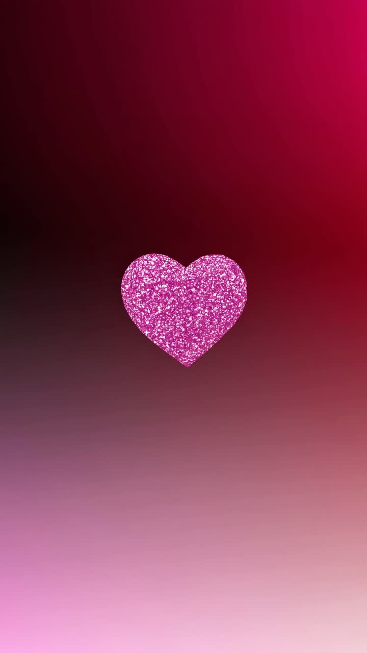 A glittery pink heart centered on a gradient background, viewed from a straight-on angle