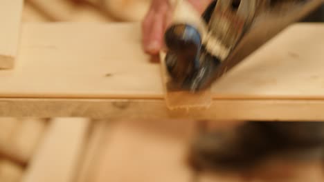boat building creating a chamfered edge on wood plank