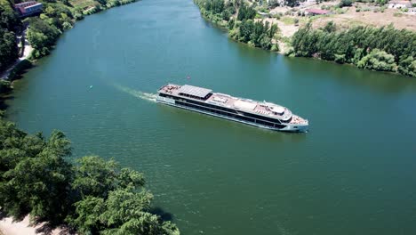 Luxurious-cruise-ship-sailing-on-Douro-river-in-Portugal-on-sunny-day