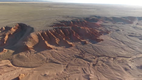 Cañón-Desierto-De-Gobi-Acantilados-Llameantes-Vista-Aérea-Mongolia-Puesta-De-Sol-Llamarada