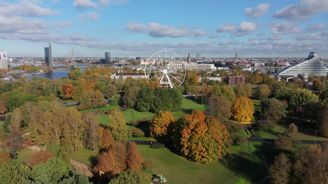 Aerial establishing shot of Riga Latvia skyline autumn parks colorful foliage