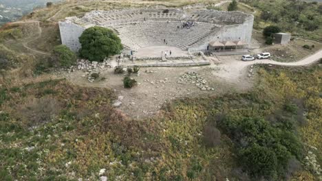 aerial-view-of-Archaeological-Park-of-Segesta-ruins-in-Sicily-,-Italy,-the-main-theatre-up-the-hill