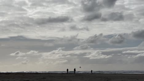 happy family at the seacoast of oregon during cloudy day in the united states