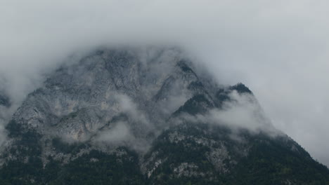 mountain peak shrouded in clouds