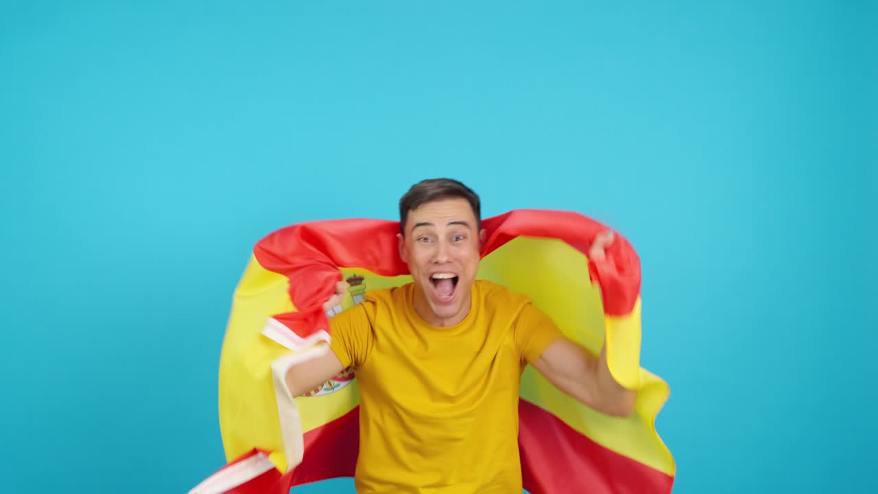 A man holding a Spain flag