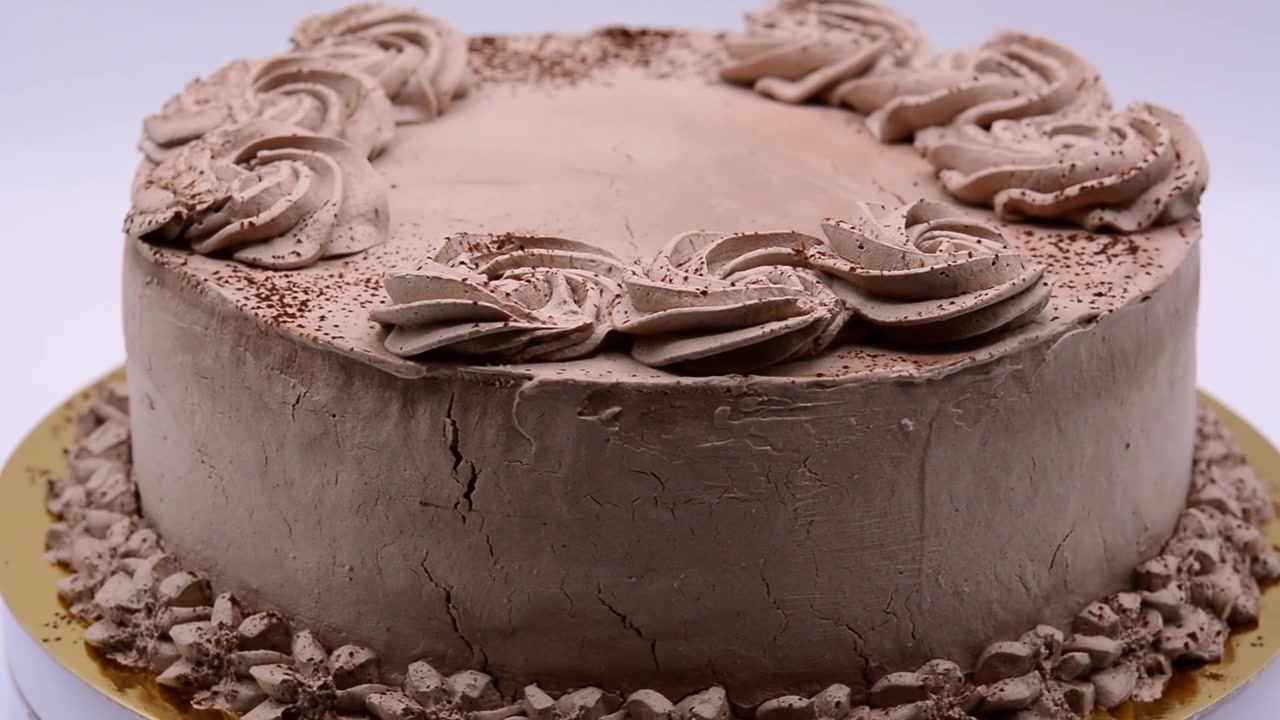 Piece of chocolate truffle cake circling footage