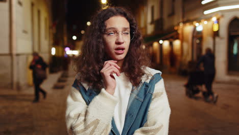 sad unhappy depressed lonely teenager girl thinks over life concerns burnout grief on city street
