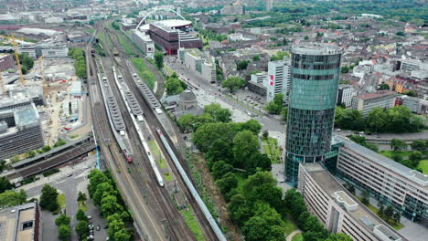 aerial shot of drone flying above the train in the city of cologne