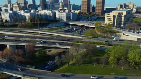 cars driving in the highways with high-rise buildings in the background in georgia, usa. - pan shot