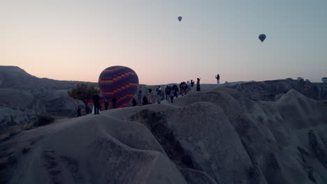 hot air balloons floating above rocky cappadocia