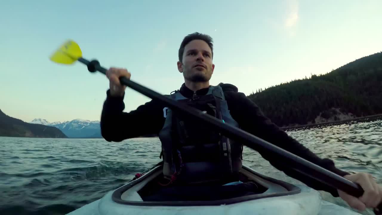 Man rowing a boat in the river 4k