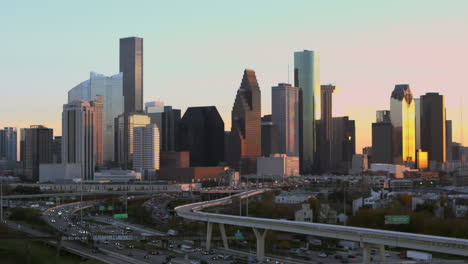 panning right shot of downtown houston, texas during sunset