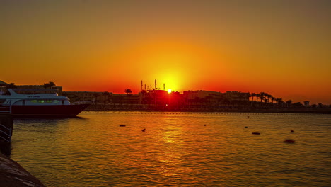 sunrise behind tropical resort township, fusion time lapse