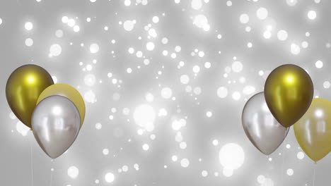 animation of gold and silver balloons over silver background